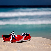 Buy canvas prints of Red Sneakers at the Beach by Thomas Herzog