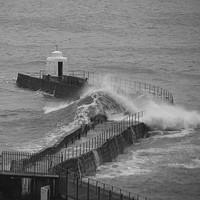 Buy canvas prints of Portreath Pier taking a battering by Tim Woolcock
