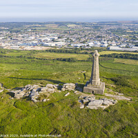 Buy canvas prints of Aerial photograph of Carn Brea Monument, Redruth, Cornwall by Tim Woolcock
