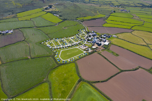 Aerial photograph of a patchwork of farmers fields near St Ives Picture Board by Tim Woolcock