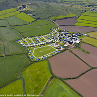 Buy canvas prints of Aerial photograph of a patchwork of farmers fields near St Ives by Tim Woolcock