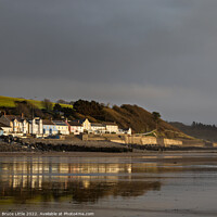 Buy canvas prints of Golden Reflections at Dramatic Amroth Dawn by Bruce Little