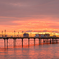 Buy canvas prints of Fiery Dawn over Teignmouth Pier by Bruce Little