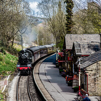 Buy canvas prints of Steam Train approaching Haworth Station by Joy Newbould