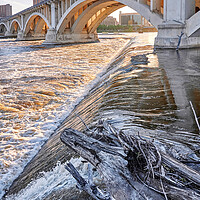 Buy canvas prints of The Mississippi in Minneapolis by Jim Hughes