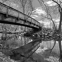 Buy canvas prints of Minnehaha Creek in March by Jim Hughes