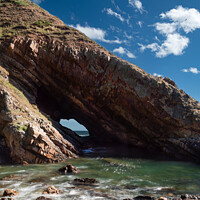 Buy canvas prints of A natural sea arch near Portknockie on the north-e by Joe Dailly