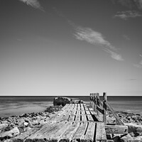 Buy canvas prints of Old breakwater at Lossiemouth beach in Mono by Joe Dailly