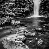 Buy canvas prints of Majestic waterfall surrounded by rocky terrain by Joe Dailly