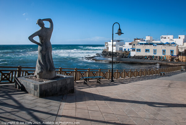 Fishermans wife Statue El Cotillo Fuertaventura  Picture Board by Joe Dailly