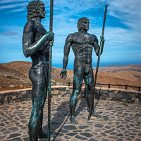 Buy canvas prints of Fuertaventura Statues Guise and Ayose  by Joe Dailly