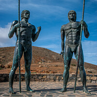 Buy canvas prints of Fuertaventura Statues Guise and Ayose  by Joe Dailly
