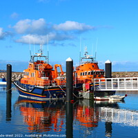 Buy canvas prints of Lifeboats in Brixham Harbour by Tom Wade-West
