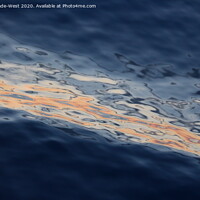 Buy canvas prints of Ripples on a glassy sea at sunset. by Tom Wade-West