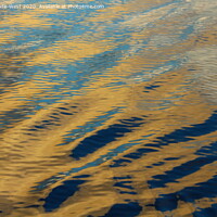 Buy canvas prints of Ripples on a glassy sea at sunset. by Tom Wade-West