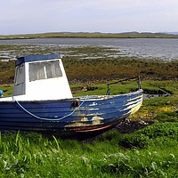 Buy canvas prints of Beached blue boat at east Loch Roag by Rhonda Surman