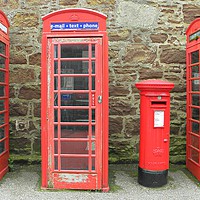 Buy canvas prints of Iconic red telephone boxes with an iconic red post by Rhonda Surman