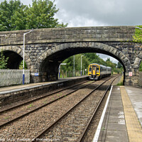 Buy canvas prints of Train at Long Preston Railway Station by Colin Green