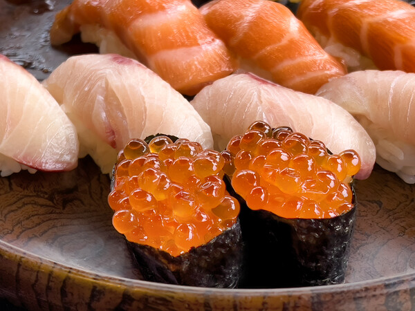 Close up of sushi salmon fish eggs with yellow tail and salmon p Picture Board by Thomas Baker