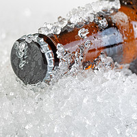 Buy canvas prints of Close up view of an ice cold beer bottle neck and  by Thomas Baker