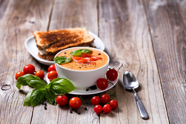 Fresh bowl of creamy tomato soup and sandwich with Picture Board by Thomas Baker