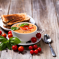 Buy canvas prints of Fresh bowl of creamy tomato soup and sandwich with by Thomas Baker