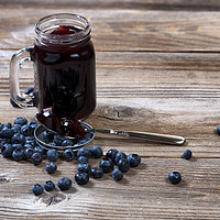 Buy canvas prints of Fresh blueberry jam and berries with glass jar on  by Thomas Baker