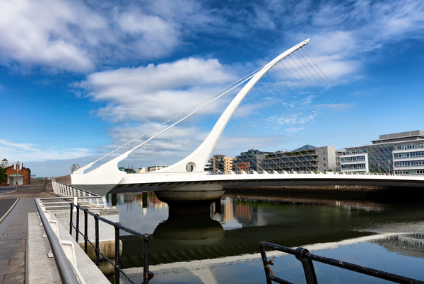 Modern cable bridge over the River Liffey in Irela Picture Board by Thomas Baker