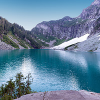 Buy canvas prints of Glacier lake with mountains and snow during summer by Thomas Baker