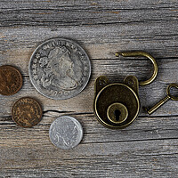 Buy canvas prints of Close up of open antique coins and lock on weather by Thomas Baker