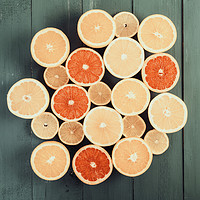 Buy canvas prints of Orange, Grapefruit And Lemon Citrus Fruit Slices by Radu Bercan