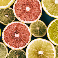 Buy canvas prints of Orange, Grapefruit And Lemon Citrus Fruit Slices by Radu Bercan