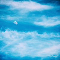 Buy canvas prints of Moon Visible In Blue Sky With White Soft Clouds by Radu Bercan