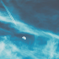 Buy canvas prints of Airplane Flying To The Moon Concept On Blue Sky by Radu Bercan