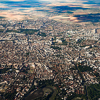 Buy canvas prints of Aerial View Of Bucharest City In Romania by Radu Bercan