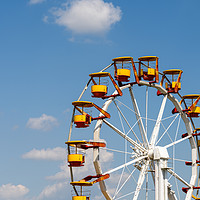 Buy canvas prints of Giant Ferris Wheel In Fun Park On Blue Sky by Radu Bercan