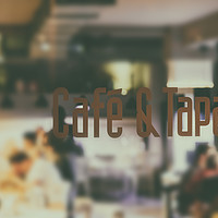 Buy canvas prints of Cafe And Tapas Restaurant Sign With Blurred People by Radu Bercan