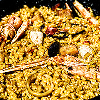 Buy canvas prints of Traditional Valencian Paella With Rice And Seafood by Radu Bercan