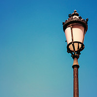 Buy canvas prints of Vintage Street Lamp On Blue Sky by Radu Bercan