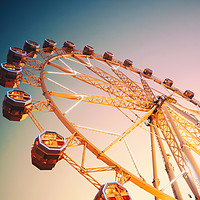 Buy canvas prints of Giant Ferris Wheel In Fun Park On Night Sky by Radu Bercan