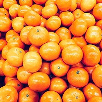 Buy canvas prints of Orange Tangerines In Fruit Market by Radu Bercan