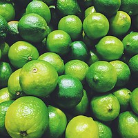 Buy canvas prints of Lime Citrus Fruits In Fruit Market by Radu Bercan