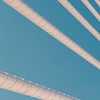 Buy canvas prints of Steel Bridge Cables On Blue Sky by Radu Bercan