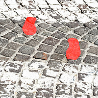 Buy canvas prints of Red footsteps in town by Massimo Lama