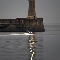 Buy canvas prints of Tynemouth Lighthouse Reflections by AMANDA AINSLEY