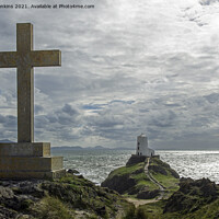 Buy canvas prints of Cross overlooking the Lighthouse Llanddwyn Island by Nick Jenkins