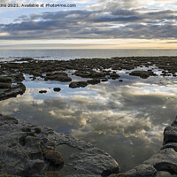 Buy canvas prints of Rock Pool amazing cloud reflections Dunraven Bay by Nick Jenkins