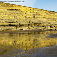 Buy canvas prints of Dunraven Bay Cliffs reflected in the wet sand  by Nick Jenkins