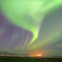 Buy canvas prints of Aurora over south Iceland at the town of Hofn by Nick Jenkins