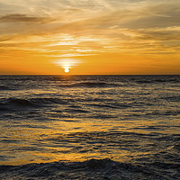 Buy canvas prints of The Sun Setting over Llantwit Major Beach Glamorga by Nick Jenkins